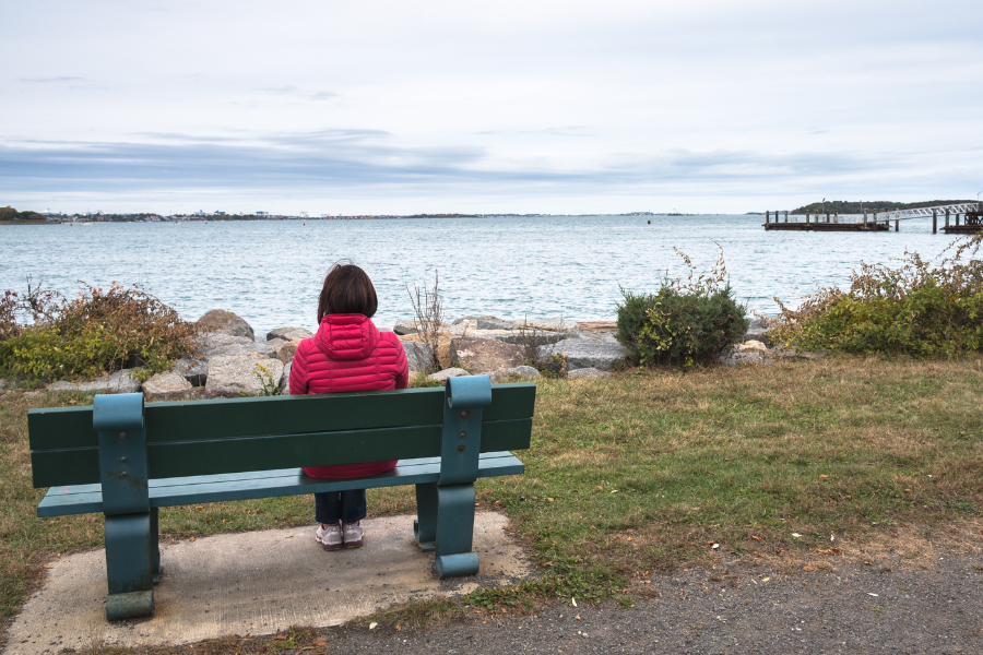 overcoming loneliness woman on bench