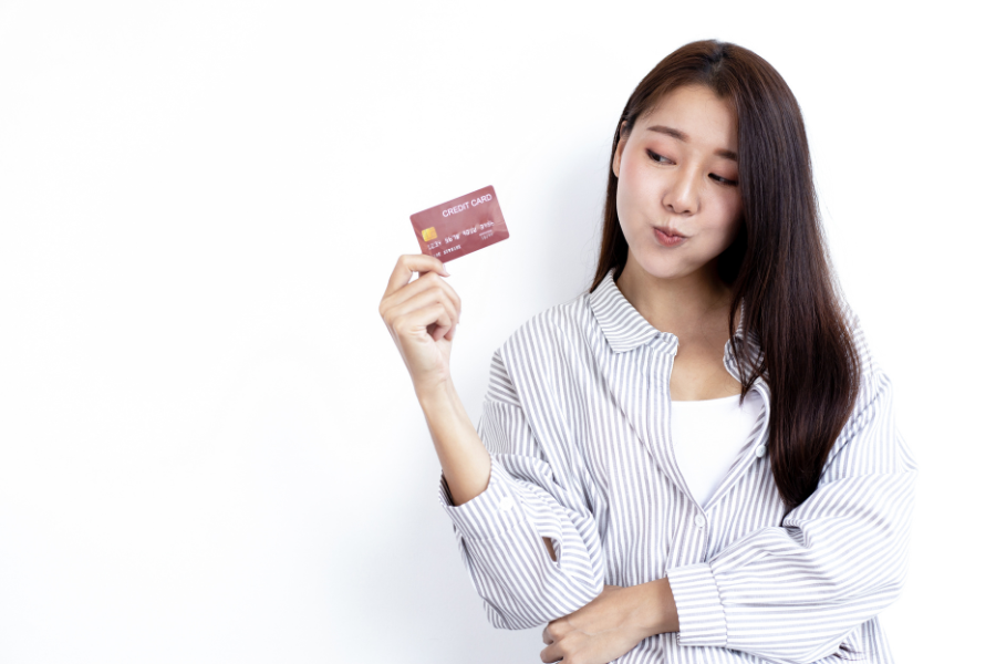 woman preparing to use her credit card