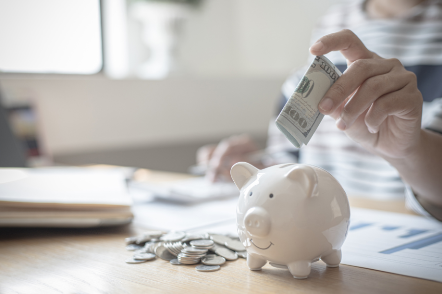 fill a white piggy bank with saving money challenges